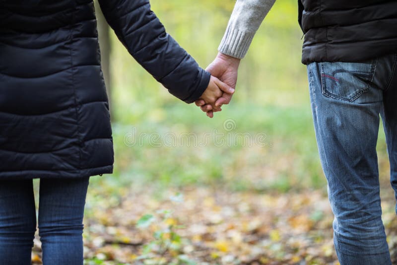 The guy and the girl is holding hands stock images The guy and the girl is holding hands stock images