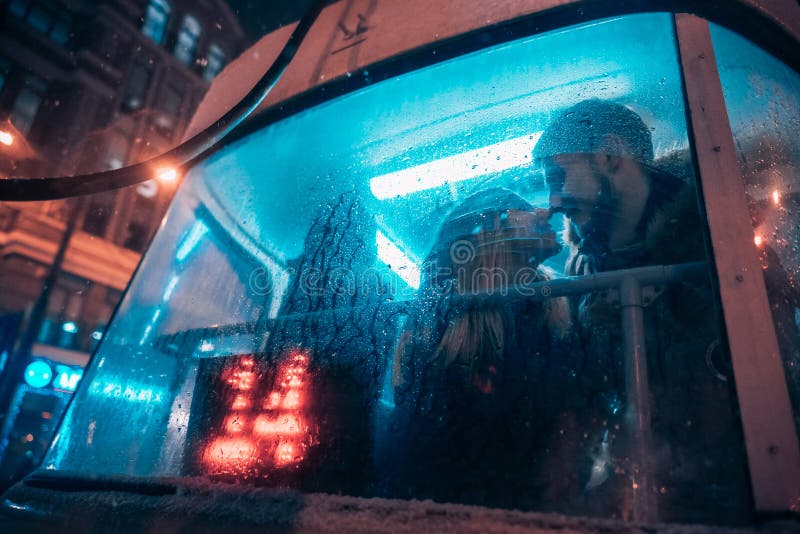 The guy and the girl kiss on the tram behind the misted glass royalty free stock images The guy and the girl kiss on the tram behind the misted glass royalty free stock images