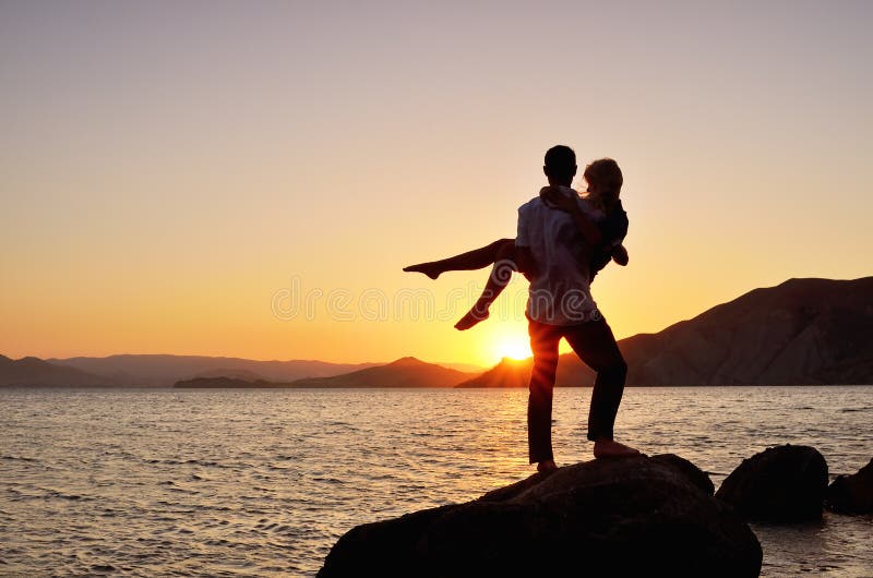 Guy Holding the Girl in His Arms Stock Photo Image of sunlight, girl