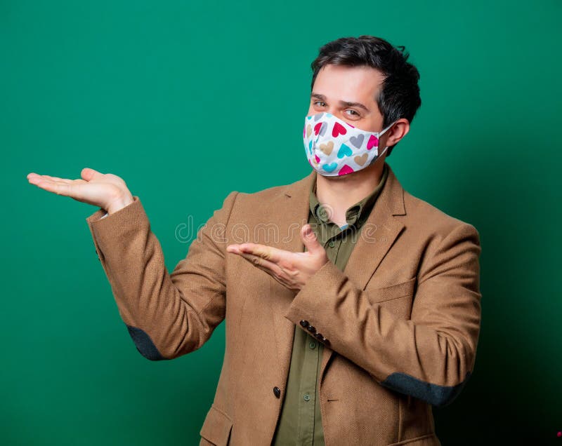 Guy in jacket and face mask stock images