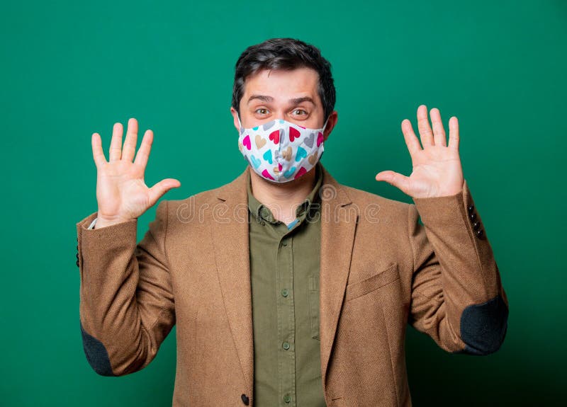 Guy in jacket and face mask stock images