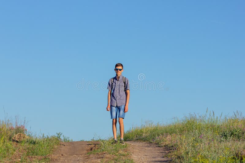 Guy jumping to the top on the road, travel concept stock photos Guy jumping to the top on the road, travel concept stock photos