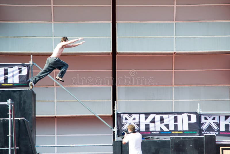 A guy jumps in the parkour path