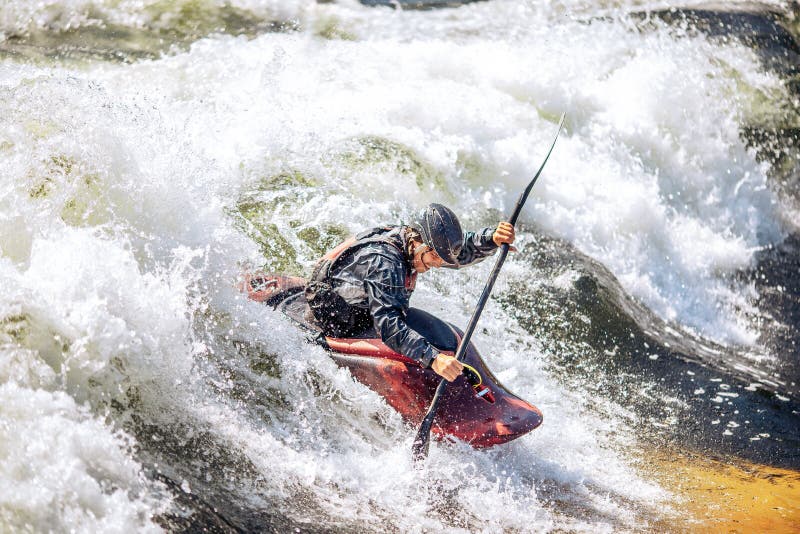 Guy in Kayak Sails Mountain River. Whitewater Kayaking, Extreme Sport Rafting Stock Photo