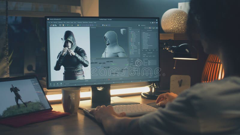 Male 3D designer sitting at the table at home and making animation for video game character, using modern computer and software for creating 3D modeling projects. Create graphic stock images, royalty-free photos and pictures