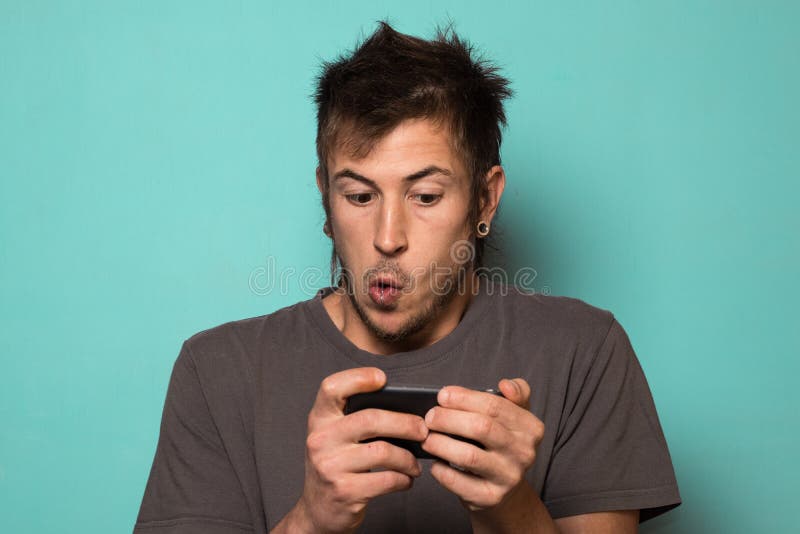 Guy Making a Selfie with Funny Faces. Guy Taking Pictures with His