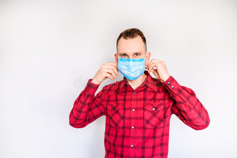 Guy Puts Medical Mask on the Face, Isolated Stock Image - Image of male ...