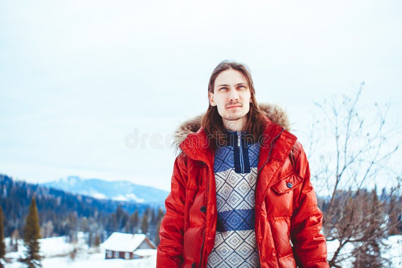 The guy sitting in the snow stock image