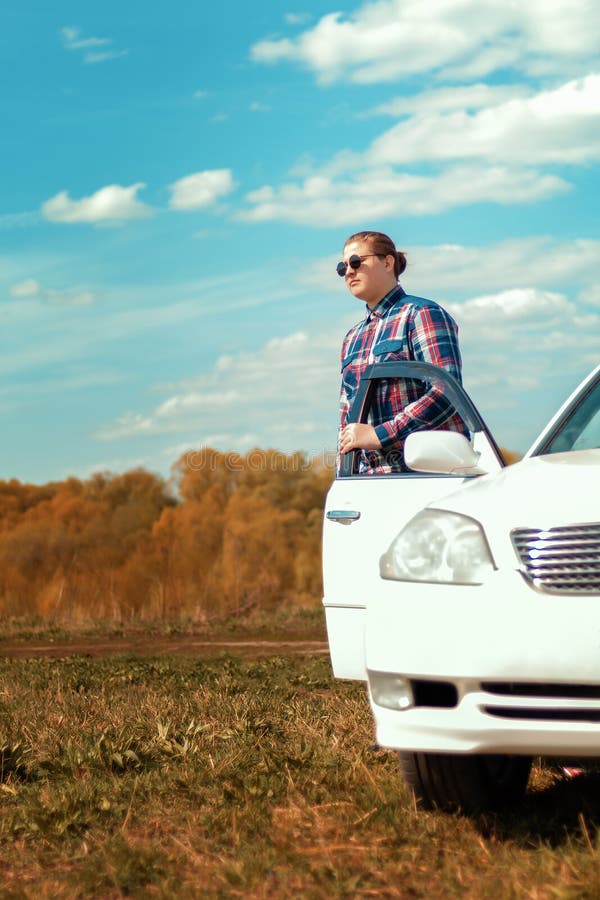 The Guy in Sunglasses Sitting in the Car Driving Stock Photo Image of hair, serious 147648444