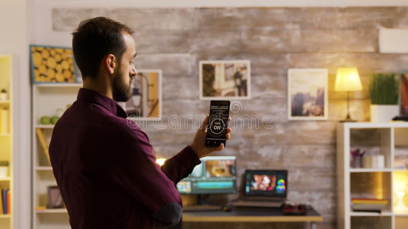 Guy Uses His Smart Light Application To Turn On The Light Bulbs In The