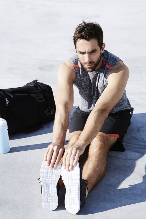 Guy Warming up before exercise royalty free stock image Guy Warming up before exercise royalty free stock image