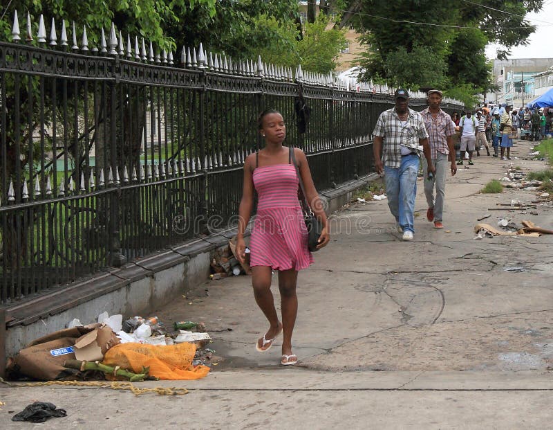 Guyana, Georgetown: Sidewalk/Pedestrians in the City Center. This is the sidewalk of Lombard Street, near Stabroek Market; the cast iron railing surrounds the stock photography Guyana, Georgetown: Sidewalk/Pedestrians in the City Center. This is the sidewalk of Lombard Street, near Stabroek Market; the cast iron railing surrounds the stock photography