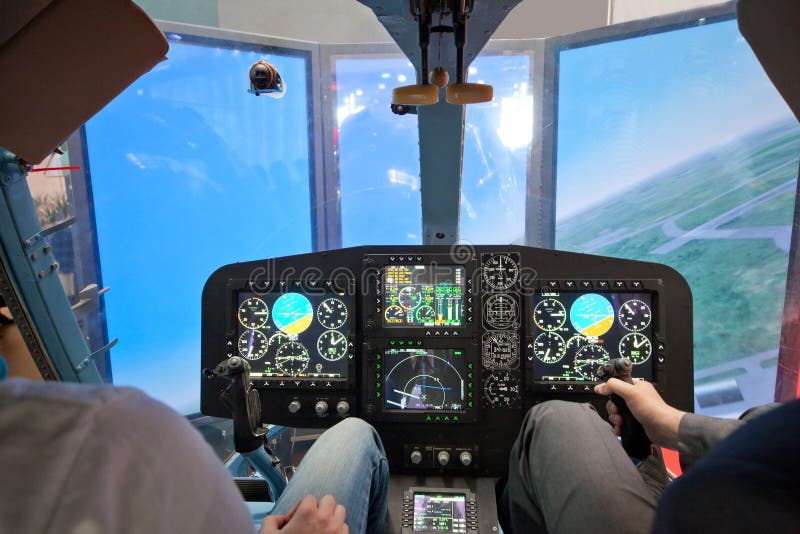 Guys flying on helicopter simulator stock photos