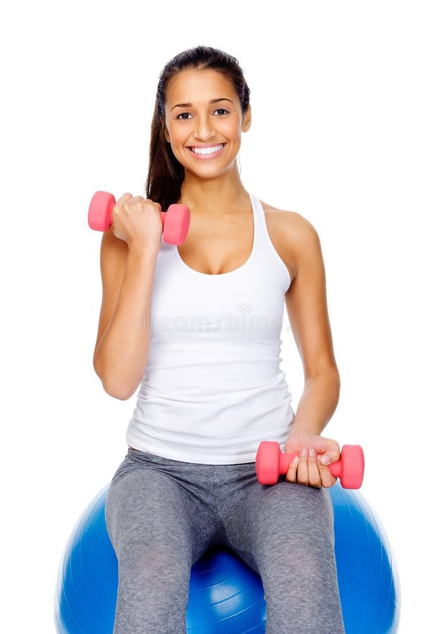 Gym woman on ball with dumbbells