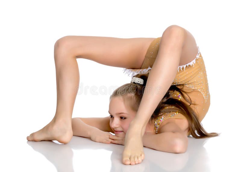 The gymnast perform an acrobatic element on the floor. royalty free stock photos