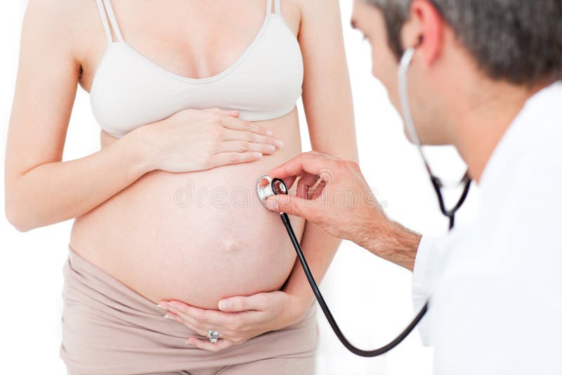 Gynecologist examining a pregnant woman royalty free stock photography Gynecologist examining a pregnant woman royalty free stock photography