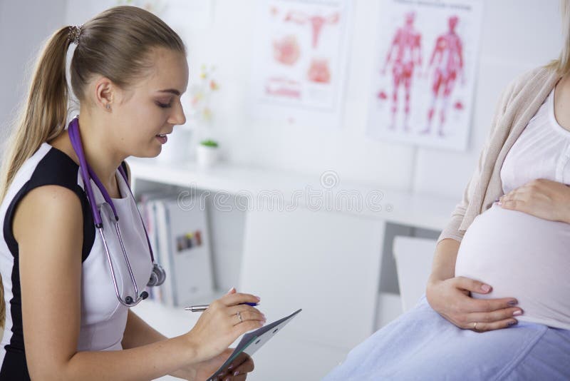 Gynecology Consultation Pregnant Woman With Her Doctor In Clinic Stock Image Image Of 