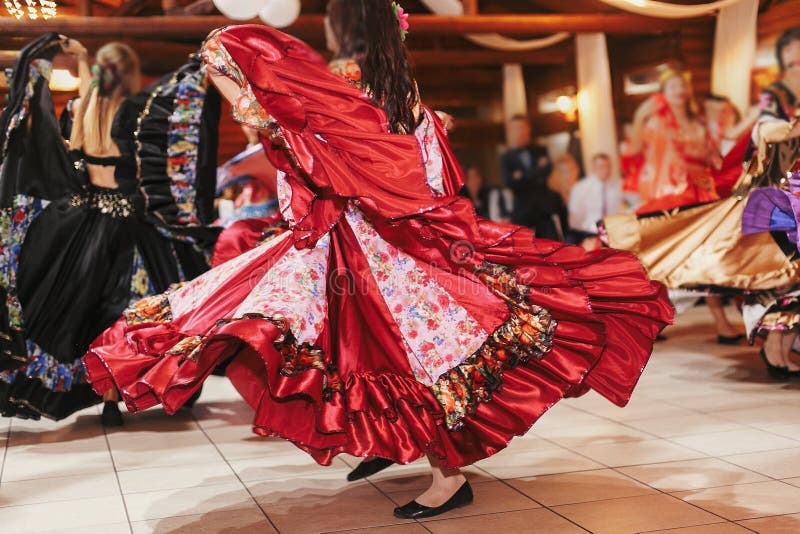 Gypsy dance festival, Woman performing romany dance and folk songs in national clothing. Beautiful roma gypsy girls dancing in