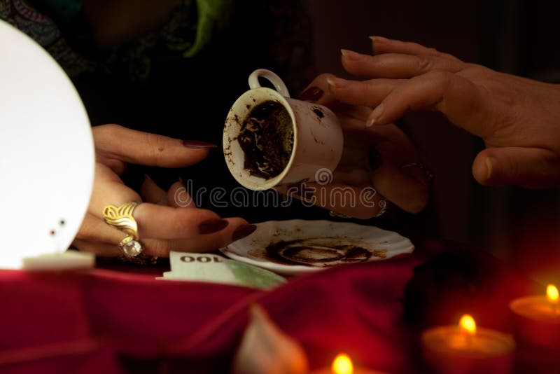 Gypsy Fortune Teller Holds a Coffee Cup for Fortune Telling Stock Image