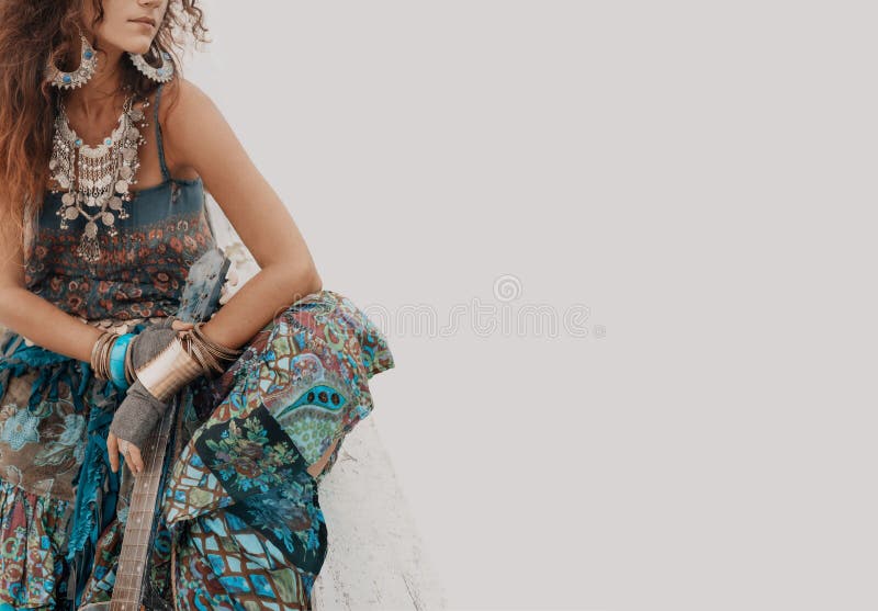Gypsy hippie styled young woman with guitar stock photography Gypsy hippie styled young woman with guitar stock photography
