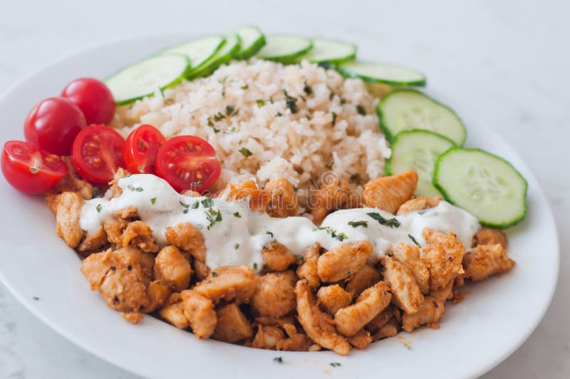 Gyros Chicken with Rice, Tzatziki Dressing and Vegetables Stock Photo ...