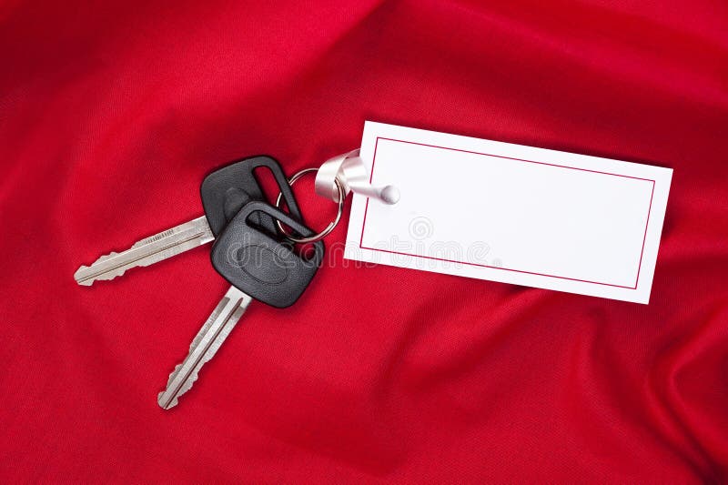 A set of new car keys with ribbon attached to a blank card for copy. Good for Valentines Day or Christmas inferences or any inference where red is the designers appeal. A set of new car keys with ribbon attached to a blank card for copy. Good for Valentines Day or Christmas inferences or any inference where red is the designers appeal.