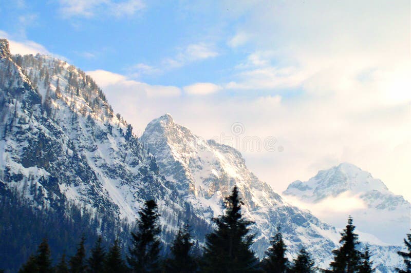 Winter scene of the tall mountain covered by snow. Winter scene of the tall mountain covered by snow