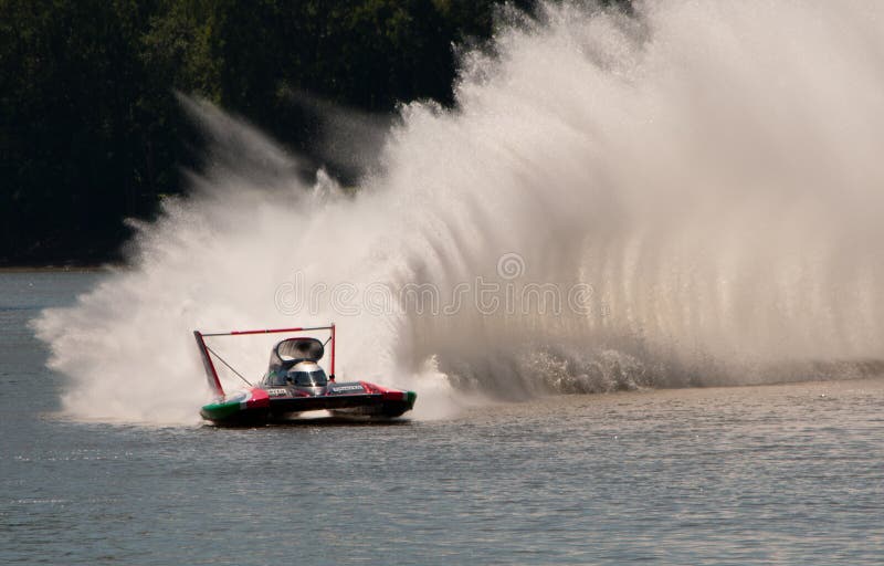 Madison, Indiana - July 5, 2014: Jimmy Shane drives the U-6 Oberto-Miss Madison hydroplane during a testing session at the Madison Regatta in Madison, Indiana on July 5, 2014. Madison, Indiana - July 5, 2014: Jimmy Shane drives the U-6 Oberto-Miss Madison hydroplane during a testing session at the Madison Regatta in Madison, Indiana on July 5, 2014.