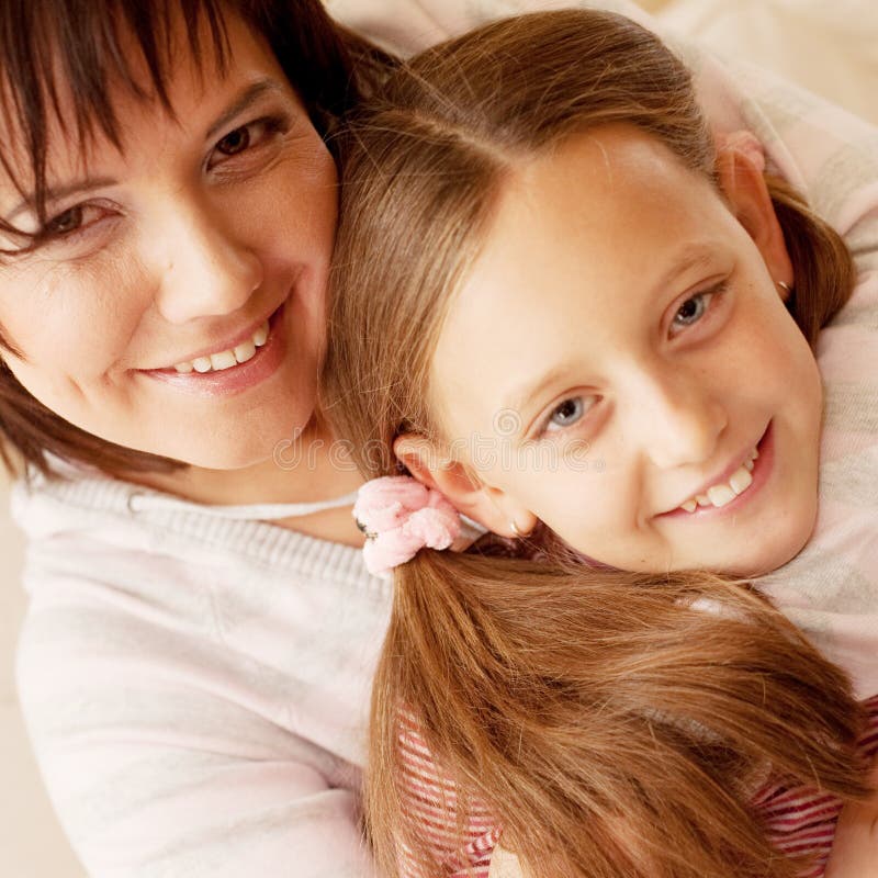 Beautiful Young Mother With A Small Daughter 8 Years Embrace Each Other Stock Image Image Of 