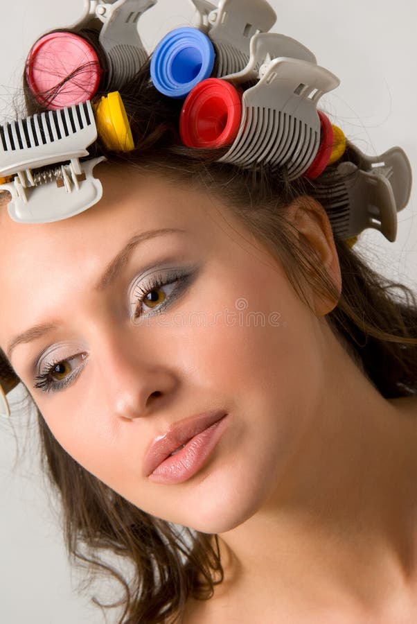 Nice girl with colorful hair-curlers. Nice girl with colorful hair-curlers