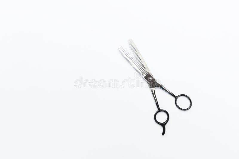Schaar voor het uitdunnen van haar geïsoleerd op witte achtergrond stock fotografie