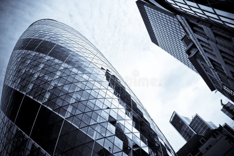 iconic architecture 30 st mary axe skyscraper swiss re building in londons city sometimes called the gherkin. iconic architecture 30 st mary axe skyscraper swiss re building in londons city sometimes called the gherkin