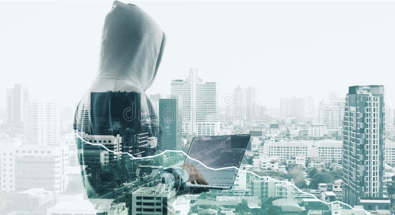 Hacker back with laptop and city royalty free stock photo