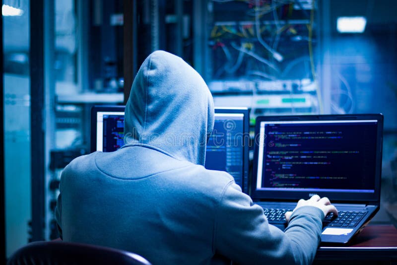 Dangerous hackers hack into corporate servers.They often have multiple data display screens and they hide themselves in darkness. Dangerous hackers hack into corporate servers.They often have multiple data display screens and they hide themselves in darkness.