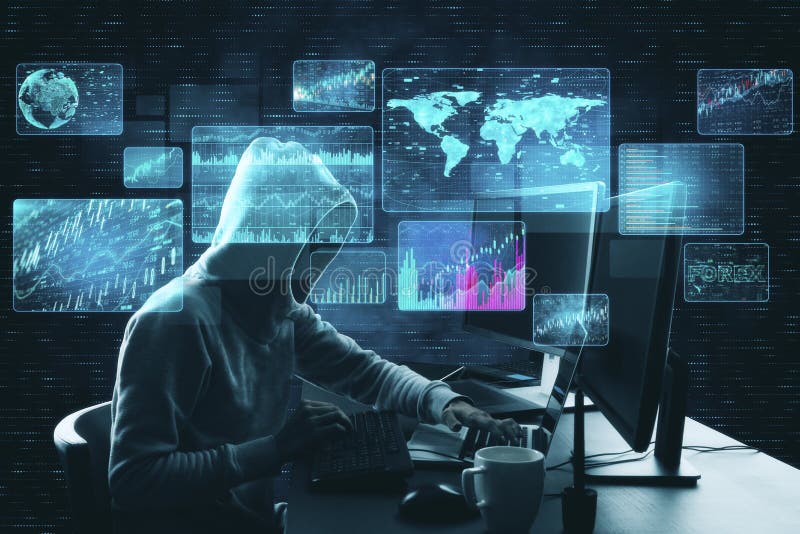 Hacker at desktop using laptop stock photo