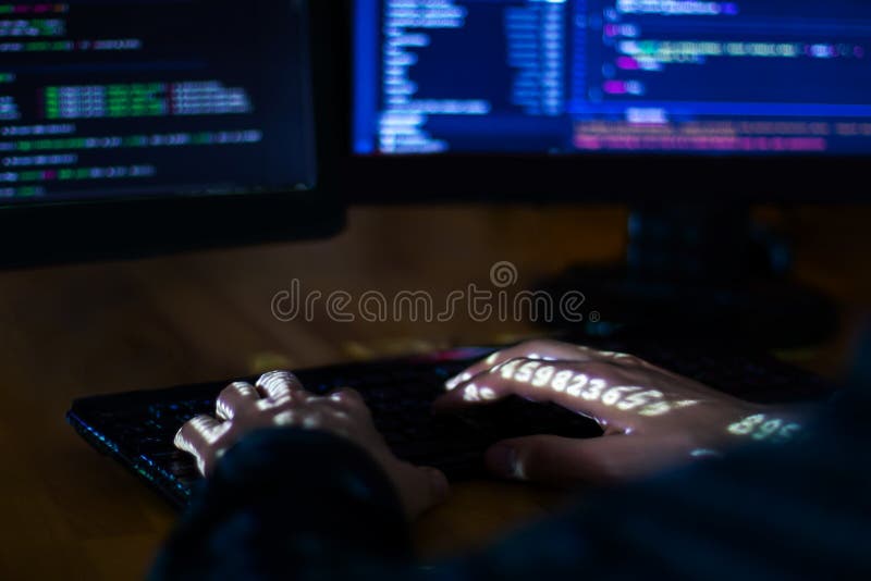 Hands of software developer freelancer working with program code C++ Java Javascript at night Develops application framework Man hacking password Programmer stealing private information Hacker attack concept. Hacker hacking computer password. Javascript framework stock images, royalty-free photos and pictures