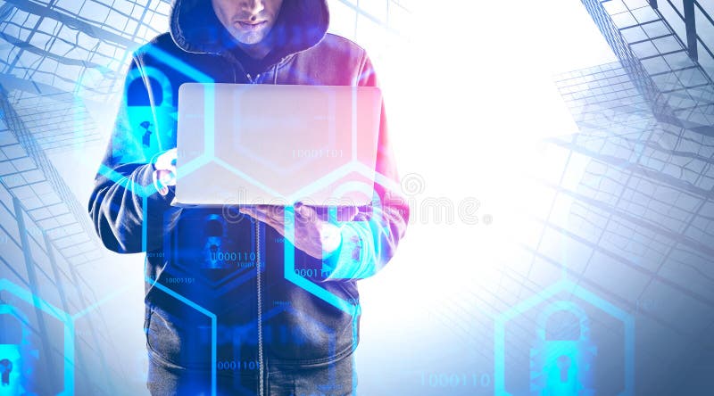 Hacker with laptop in city, cyber security royalty free stock images