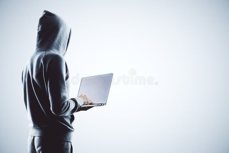 Hacker with laptop stock illustration