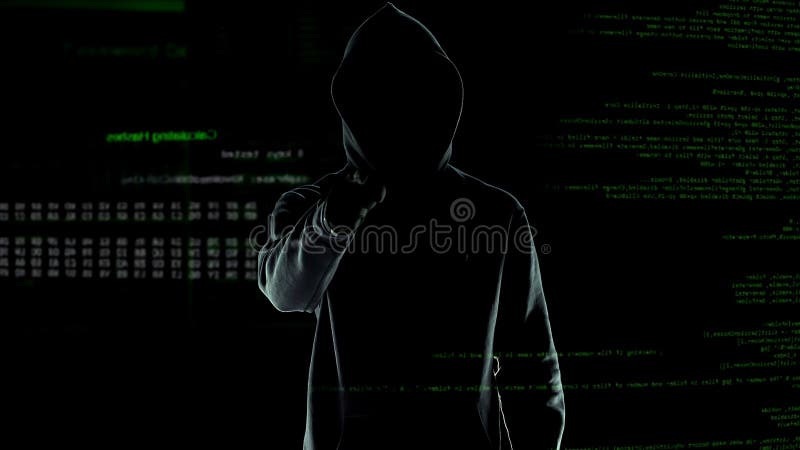 Hacker makes threatening gesture into the camera, cyber attack and blackmail royalty free stock images Hacker makes threatening gesture into the camera, cyber attack and blackmail royalty free stock images