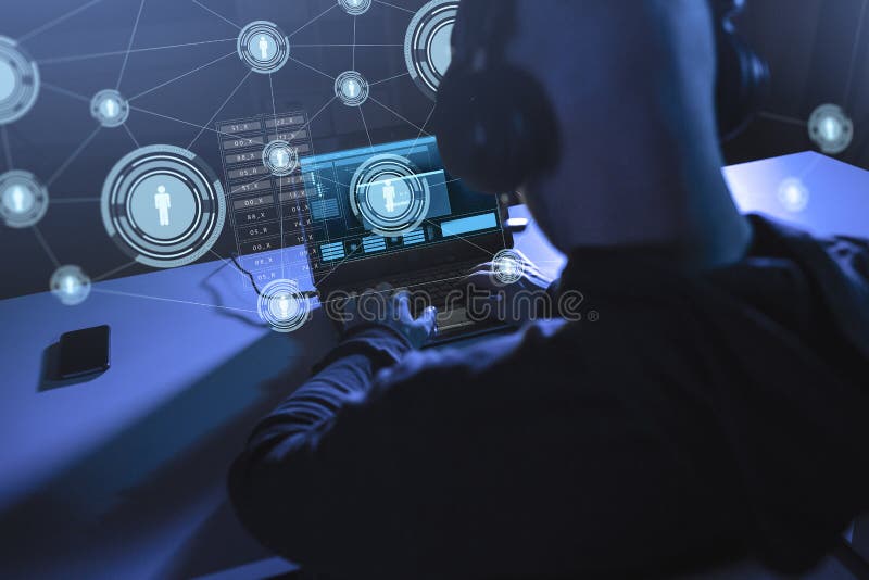 Hacker with network using laptop computer stock photo