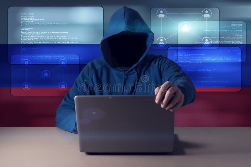 Hacker sitting in front of a laptop stock photos Hacker sitting in front of a laptop stock photos