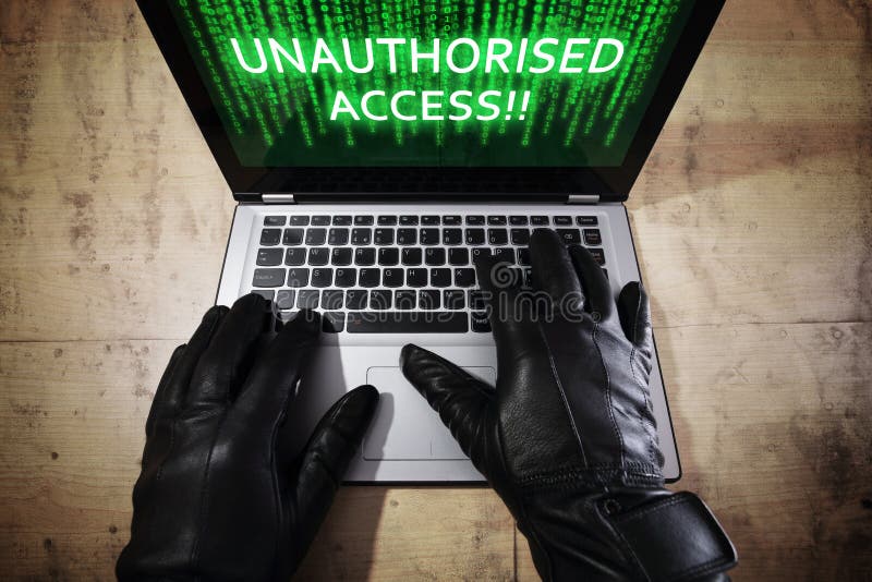 Hacker stealing data from a laptop royalty free stock images