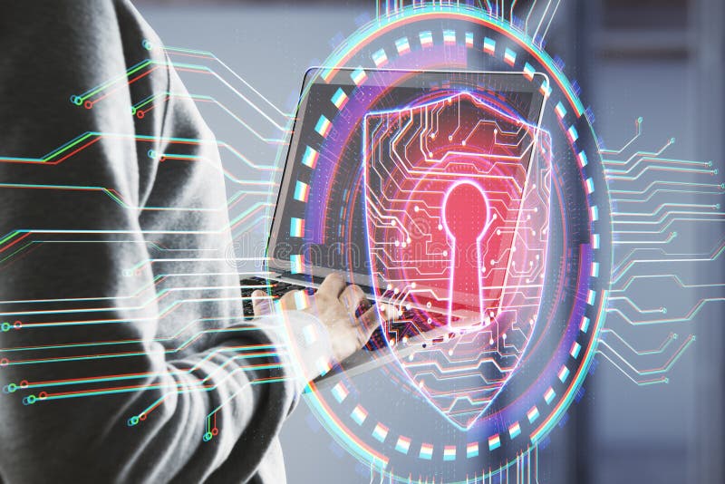 Hacker using laptop with antivirus shield hologram stock image