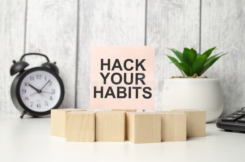 hack your habits words with clock with wooden blocks. hack your habits words with clock with wooden blocks