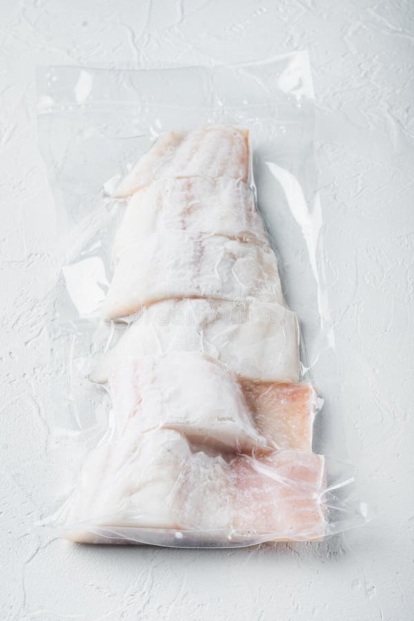 Haddock Fish Skinless in Vacuum Pack, on White Background Stock Photo