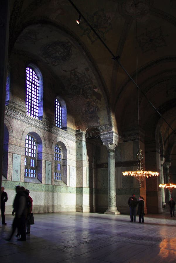 Hagia Sophia (Greek: á¼‰Î³Î¯Î± Î£Î¿Ï†Î¯Î±; Holy Wisdom, Turkish: Ayasofya) is a former patriarchal basilica, later a mosque, now a museum, in Istanbul, Turkey. Famous in particular for its massive dome, it is considered the epitome of Byzantine architecture. It was the largest cathedral in the world for nearly a thousand years, until the completion of the Medieval Seville Cathedral in 1520. The current building was originally constructed as a church between 532 and 537 AD on the orders of the Byzantine Emperor Justinian, It contained a large collection of holy relics and featured, among other things, a 50 ft (15 m) silver iconostasis. It was the patriarchal church of the Patriarch of Constantinople and the religious focus point of the Eastern Orthodox Church for nearly 1000 years. In 1453, Constantinople was conquered by the Ottoman Turks and Sultan Mehmed II ordered the building to be converted into a mosque. The bells, altar, iconostasis, and sacrificial vessels were removed, and many of the mosaics were eventually plastered over. The Islamic features - such as the mihrab, the minbar, and the four minarets outside - were added over the course of its history under the Ottomans. It remained as a mosque until 1935, when it was converted into a museum by the secular Republic of Turkey. The historic areas of Istanbul were added to the UNESCO World Heritage List in 1985. Hagia Sophia (Greek: á¼‰Î³Î¯Î± Î£Î¿Ï†Î¯Î±; Holy Wisdom, Turkish: Ayasofya) is a former patriarchal basilica, later a mosque, now a museum, in Istanbul, Turkey. Famous in particular for its massive dome, it is considered the epitome of Byzantine architecture. It was the largest cathedral in the world for nearly a thousand years, until the completion of the Medieval Seville Cathedral in 1520. The current building was originally constructed as a church between 532 and 537 AD on the orders of the Byzantine Emperor Justinian, It contained a large collection of holy relics and featured, among other things, a 50 ft (15 m) silver iconostasis. It was the patriarchal church of the Patriarch of Constantinople and the religious focus point of the Eastern Orthodox Church for nearly 1000 years. In 1453, Constantinople was conquered by the Ottoman Turks and Sultan Mehmed II ordered the building to be converted into a mosque. The bells, altar, iconostasis, and sacrificial vessels were removed, and many of the mosaics were eventually plastered over. The Islamic features - such as the mihrab, the minbar, and the four minarets outside - were added over the course of its history under the Ottomans. It remained as a mosque until 1935, when it was converted into a museum by the secular Republic of Turkey. The historic areas of Istanbul were added to the UNESCO World Heritage List in 1985.