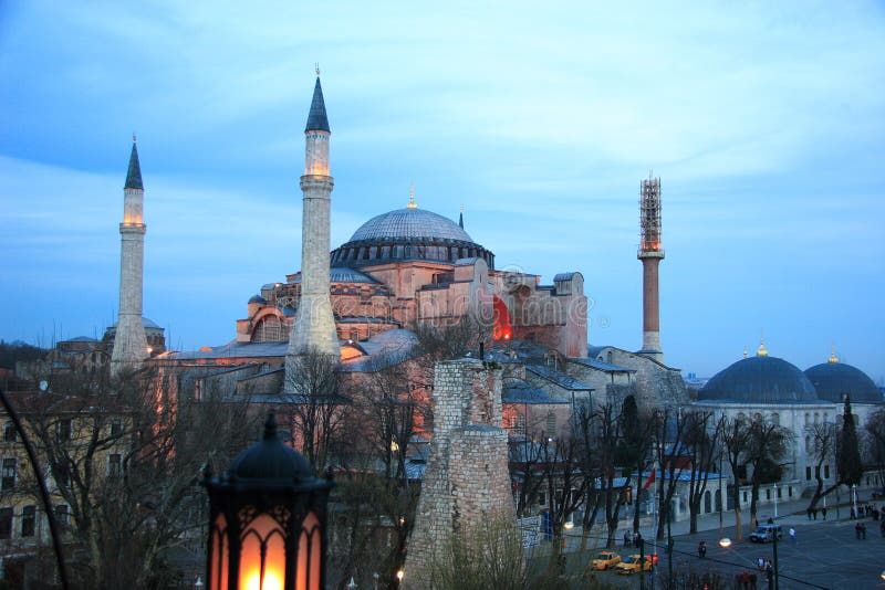 Hagia Sophia (Greek: á¼‰Î³Î¯Î± Î£Î¿Ï†Î¯Î±; Holy Wisdom, Turkish: Ayasofya) is a former patriarchal basilica, later a mosque, now a museum, in Istanbul, Turkey. Famous in particular for its massive dome, it is considered the epitome of Byzantine architecture. It was the largest cathedral in the world for nearly a thousand years, until the completion of the Medieval Seville Cathedral in 1520. The current building was originally constructed as a church between 532 and 537 AD on the orders of the Byzantine Emperor Justinian, It contained a large collection of holy relics and featured, among other things, a 50 ft (15 m) silver iconostasis. It was the patriarchal church of the Patriarch of Constantinople and the religious focus point of the Eastern Orthodox Church for nearly 1000 years. In 1453, Constantinople was conquered by the Ottoman Turks and Sultan Mehmed II ordered the building to be converted into a mosque. The bells, altar, iconostasis, and sacrificial vessels were removed, and many of the mosaics were eventually plastered over. The Islamic features - such as the mihrab, the minbar, and the four minarets outside - were added over the course of its history under the Ottomans. It remained as a mosque until 1935, when it was converted into a museum by the secular Republic of Turkey. The historic areas of Istanbul were added to the UNESCO World Heritage List in 1985. Hagia Sophia (Greek: á¼‰Î³Î¯Î± Î£Î¿Ï†Î¯Î±; Holy Wisdom, Turkish: Ayasofya) is a former patriarchal basilica, later a mosque, now a museum, in Istanbul, Turkey. Famous in particular for its massive dome, it is considered the epitome of Byzantine architecture. It was the largest cathedral in the world for nearly a thousand years, until the completion of the Medieval Seville Cathedral in 1520. The current building was originally constructed as a church between 532 and 537 AD on the orders of the Byzantine Emperor Justinian, It contained a large collection of holy relics and featured, among other things, a 50 ft (15 m) silver iconostasis. It was the patriarchal church of the Patriarch of Constantinople and the religious focus point of the Eastern Orthodox Church for nearly 1000 years. In 1453, Constantinople was conquered by the Ottoman Turks and Sultan Mehmed II ordered the building to be converted into a mosque. The bells, altar, iconostasis, and sacrificial vessels were removed, and many of the mosaics were eventually plastered over. The Islamic features - such as the mihrab, the minbar, and the four minarets outside - were added over the course of its history under the Ottomans. It remained as a mosque until 1935, when it was converted into a museum by the secular Republic of Turkey. The historic areas of Istanbul were added to the UNESCO World Heritage List in 1985.