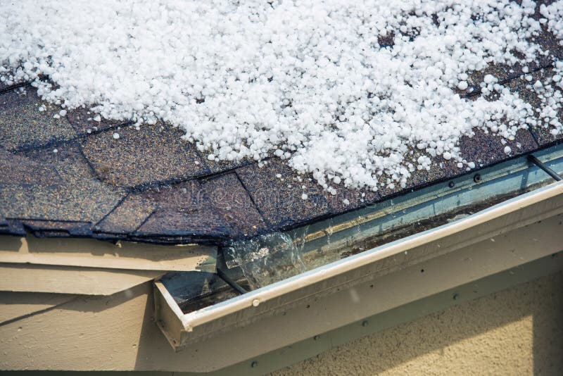 Small Melting Hail on the Roof. Severe Weather Concept.