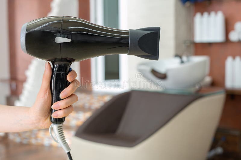 Hair Dryer Professional Hair Dresser Tool in Hairdresser`s Hand Against Beauty Salon Interior Background. Hair Stylist Work Space Stock Image - Image of interior, barber: 183300743 Hair Dryer Professional Hair Dresser Tool in Hairdresser`s Hand Against Beauty Salon Interior Background. Hair Stylist Work Space Stock Image - Image of interior, barber: 183300743