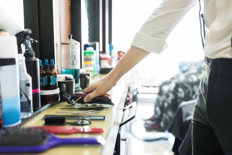 Hair Expert Keeping Trimmer on Counter in Salon Stock Image Image of